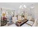 Elegant dining room with a wooden table, beige chairs, and decorative accents at 34405 Alameda Dr, Sorrento, FL 32776