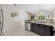 Granite countertops and stainless steel appliances in this eat-in kitchen at 34405 Alameda Dr, Sorrento, FL 32776