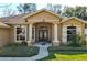 House entrance with double doors and columns at 345 Via Bianca Dr, Davenport, FL 33896