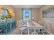 Home office with teal accents and a large window at 3555 Chinkapin Oak Ln, Apopka, FL 32703