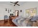 Bedroom with hardwood floors, ceiling fan and sliding glass doors at 3890 Waterview Loop, Winter Park, FL 32792