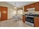 Kitchen with wood cabinets, granite counters, and a breakfast nook at 3890 Waterview Loop, Winter Park, FL 32792