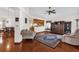 Living room with hardwood floors, a couch, and a ceiling fan at 3890 Waterview Loop, Winter Park, FL 32792