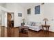 Living room with hardwood floors, a couch and end tables at 3890 Waterview Loop, Winter Park, FL 32792