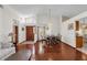 Living room with hardwood floors, and a dining area at 3890 Waterview Loop, Winter Park, FL 32792