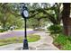 Quaint town square with clock tower and lush landscaping at 402 N Pollard St, Oakland, FL 34787