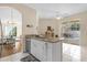 Kitchen with breakfast bar and view of pool and patio at 4213 Whitemoor Ct, Clermont, FL 34711