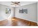 Well-lit bedroom with hardwood floors and windows at 4301 Lancashire Ln, Orlando, FL 32812