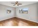 Bright bedroom featuring hardwood floors and ceiling fan at 4301 Lancashire Ln, Orlando, FL 32812