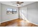 Bright bedroom featuring hardwood floors and ceiling fan at 4301 Lancashire Ln, Orlando, FL 32812