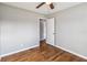 Spacious bedroom with hardwood floors and door to hallway at 4301 Lancashire Ln, Orlando, FL 32812