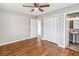 Spacious bedroom with hardwood floors and double closet at 4301 Lancashire Ln, Orlando, FL 32812