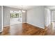 Open concept dining area with hardwood floors and chandelier at 4301 Lancashire Ln, Orlando, FL 32812