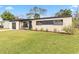 Newly renovated ranch house with attractive landscaping and a spacious yard at 4301 Lancashire Ln, Orlando, FL 32812