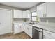 Updated kitchen featuring white shaker cabinets and stainless steel appliances at 4301 Lancashire Ln, Orlando, FL 32812