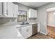 Updated kitchen featuring white cabinets and quartz countertops at 4301 Lancashire Ln, Orlando, FL 32812