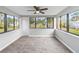 Sunroom showcasing tile flooring and large windows at 4301 Lancashire Ln, Orlando, FL 32812