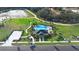 Overhead view of community pool, surrounded by lush landscaping and inviting amenities at 4485 Lions Gate Ave, Clermont, FL 34711