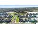 Community aerial view showcasing lush landscaping and scenic backdrop at 4485 Lions Gate Ave, Clermont, FL 34711