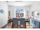 Bright dining room featuring a modern light fixture, stylish decor, and a large window at 4485 Lions Gate Ave, Clermont, FL 34711