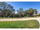 Picturesque walking trail surrounded by mature trees and lush greenery at 4485 Lions Gate Ave, Clermont, FL 34711