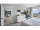 Main bedroom with white dresser and view of dining room at 475 Taylor Groves Dr, Lake Wales, FL 33898