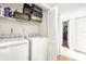 Laundry room with washer and dryer, overhead shelving, and closet at 4767 S Texas Ave # 4767C, Orlando, FL 32839