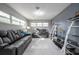 Relaxing living room featuring black leather sofas and shelving at 5006 Monet Ave, Belle Isle, FL 32812