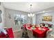 Bright dining room features a large table, chandelier, and window at 6030 Forest Ridge Ln, Winter Haven, FL 33881