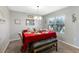 Dining room with red table setting and bench seating at 6030 Forest Ridge Ln, Winter Haven, FL 33881