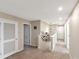 Upper hallway with multiple doors and charming photo display at 6030 Forest Ridge Ln, Winter Haven, FL 33881