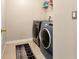 Laundry room with washer, dryer, and shelving at 6030 Forest Ridge Ln, Winter Haven, FL 33881