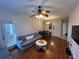 Living room with hardwood floors, sofa, and dining area at 6100 Stevenson Dr # 105, Orlando, FL 32835