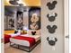 Mickey Mouse themed bedroom with two twin beds at 6152 High Seas Dr, Orlando, FL 32821