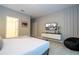 Modern bedroom with king-size bed and mounted TV at 6152 High Seas Dr, Orlando, FL 32821