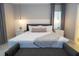 King-size bed with a modern aesthetic and pendant lighting at 6152 High Seas Dr, Orlando, FL 32821