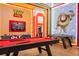 Toy Story themed game room with pool table and arcade game at 6152 High Seas Dr, Orlando, FL 32821