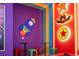 Toy Story themed game room with small tables and stools at 6152 High Seas Dr, Orlando, FL 32821