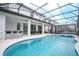 Luxury pool and spa with covered patio and outdoor kitchen at 6152 High Seas Dr, Orlando, FL 32821