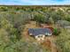 Aerial view of a single-story home with a large backyard and deck at 6514 Quarter Horse Ln, Orlando, FL 32818