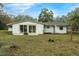 View of the back of the house and deck at 6514 Quarter Horse Ln, Orlando, FL 32818