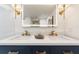 Modern bathroom with double vanity, quartz countertop, and gold fixtures at 6514 Quarter Horse Ln, Orlando, FL 32818