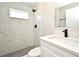 Stylish bathroom with marble shower and hexagon floor tiles at 660 Encino Way, Altamonte Springs, FL 32714