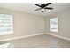 Spacious bedroom with two windows and ceiling fan at 660 Encino Way, Altamonte Springs, FL 32714