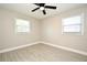 Bedroom with tile floors, ceiling fan, and two windows at 660 Encino Way, Altamonte Springs, FL 32714