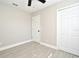 Bedroom with ceiling fan, tile floors, and double closet at 660 Encino Way, Altamonte Springs, FL 32714