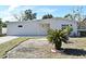 Newly renovated single story home with a paved driveway and landscaped yard at 660 Encino Way, Altamonte Springs, FL 32714