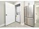 Compact laundry room with stackable washer and dryer at 660 Encino Way, Altamonte Springs, FL 32714