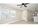 Living room with tile floors, white door, and view of kitchen at 660 Encino Way, Altamonte Springs, FL 32714