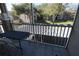 View from screened-in porch features buildings and parking under mature trees at 7123 Yacht Basin Ave # 3, Orlando, FL 32835